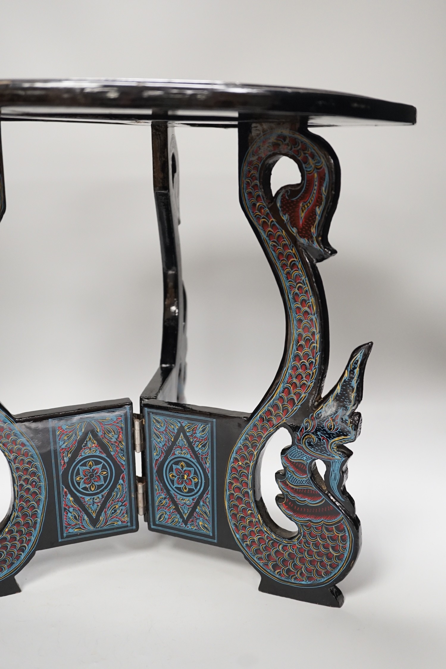 A Burmese lacquered dish and stand, 38cm tall